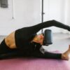a woman doing yoga with a VR on