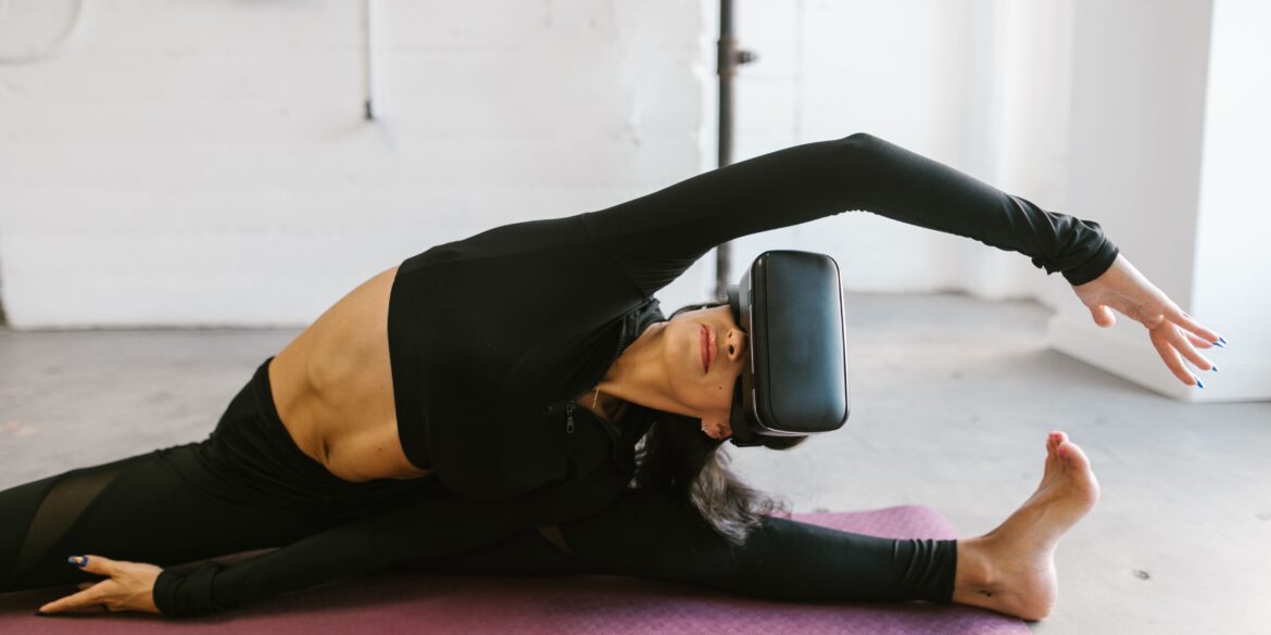 a woman doing yoga with a VR on