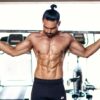 a man lifting weights in the gym
