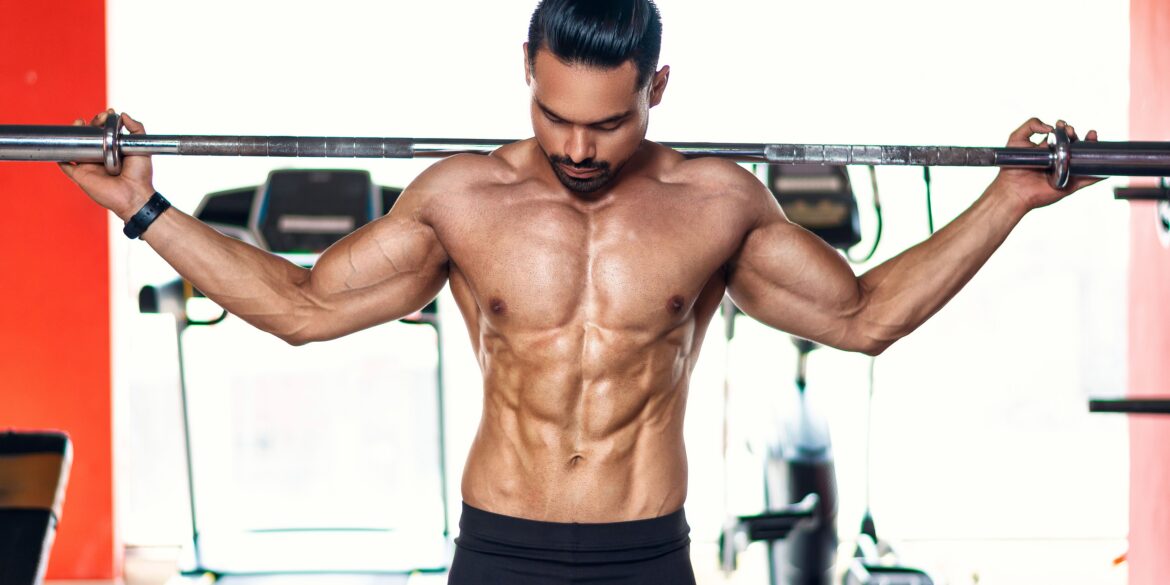 a man lifting weights in the gym