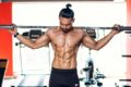 a man lifting weights in the gym
