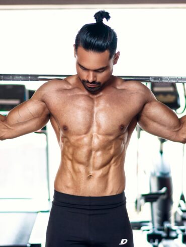 a man lifting weights in the gym