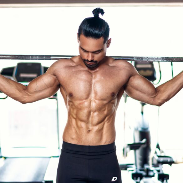 a man lifting weights in the gym
