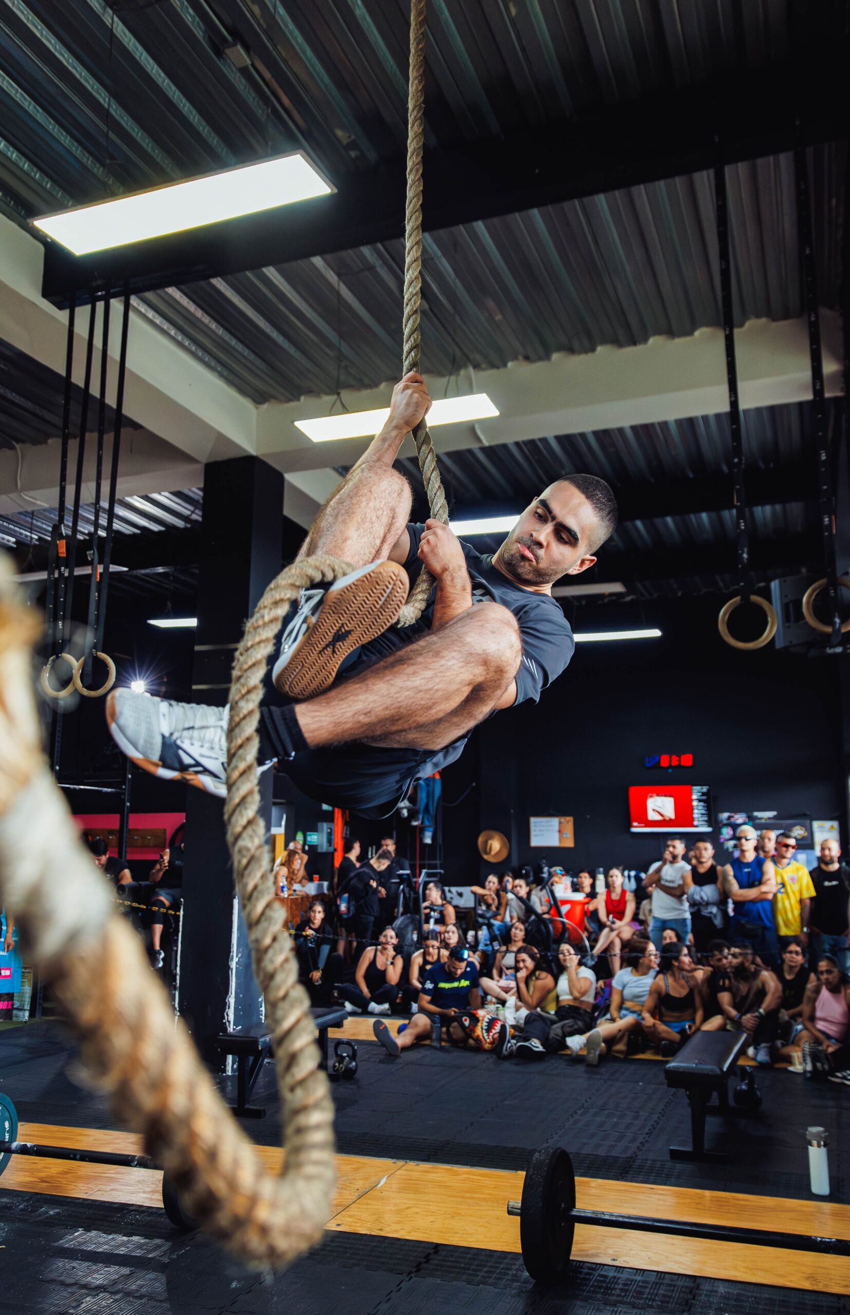 a man working out with a rope in the gym