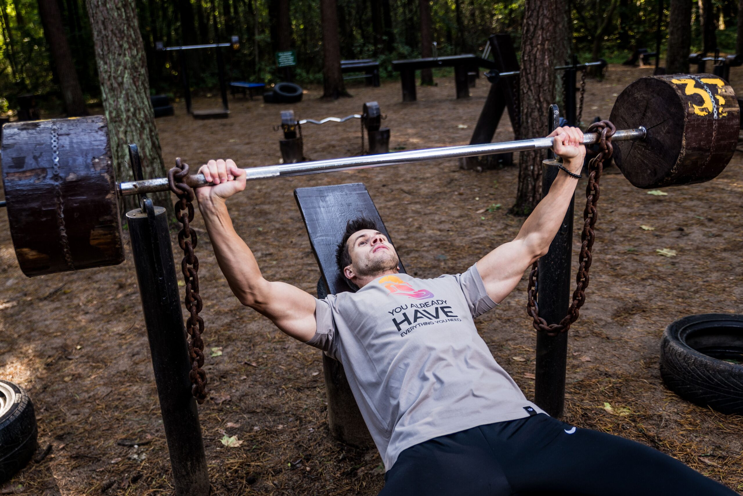 a man lifting weight in the gym