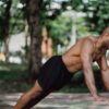 a man doing push-ups in nature