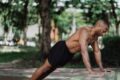 a man doing push-ups in nature