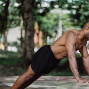 a man doing push-ups in nature