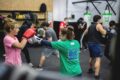 people in the gym boxing