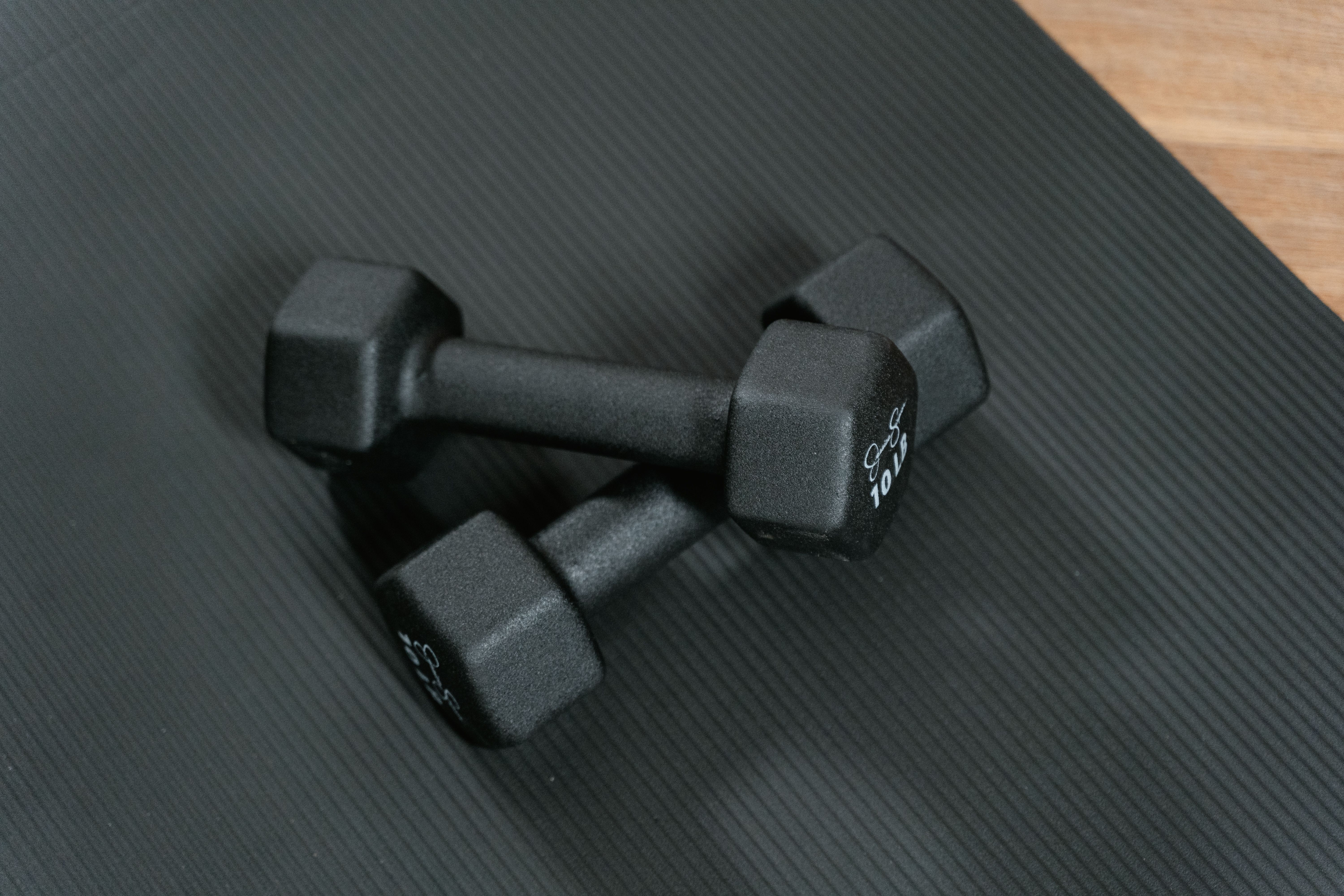 dumbbells on a yoga mat