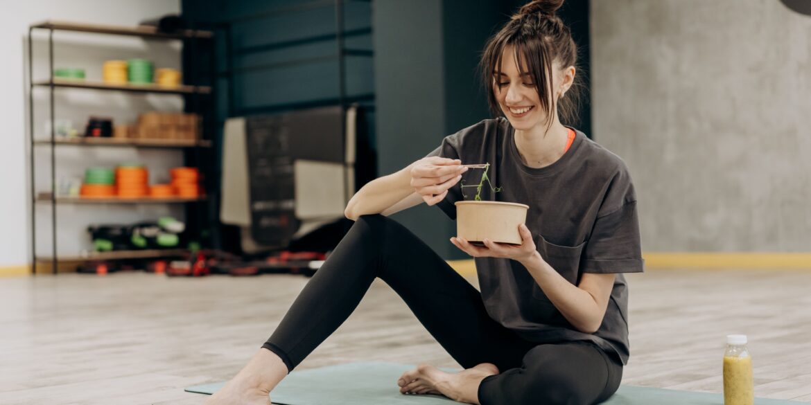 a woman eating a healthy diet after workout