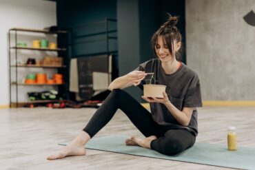 a woman eating a healthy diet after workout