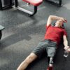 a man resting after working out in the gym