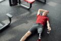 a man resting after working out in the gym