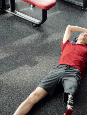a man resting after working out in the gym